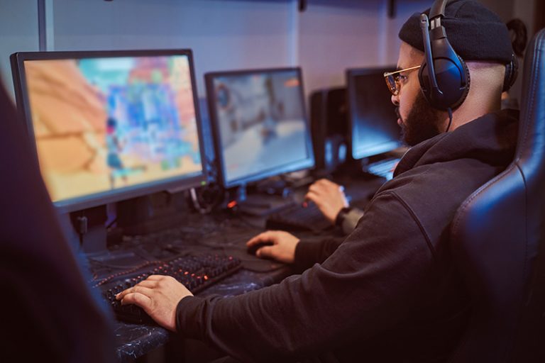 A photo of a young man playing computer games.